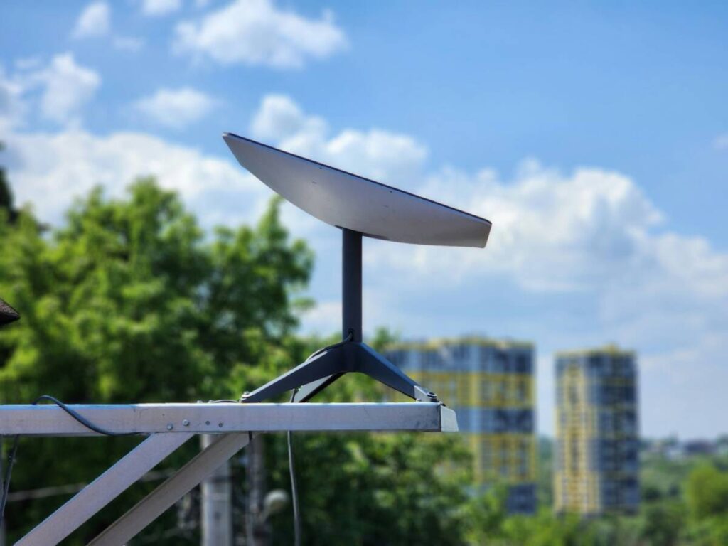 Starlink satellite dish installed on an outdoor railing
